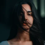 Emotional girl with hair on face expressing deep feelings, perfect for Yaad Shayari theme.